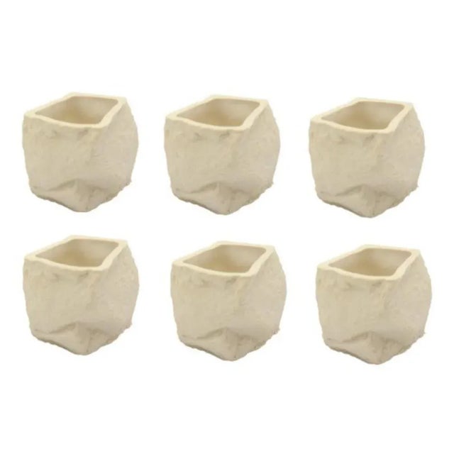 Set of 6 cups by Craig Barrow. Dimensions: 6 x 5 x 5.5cm. Volume approximate: 50ml. Materials: Slip cast porcelain shot...