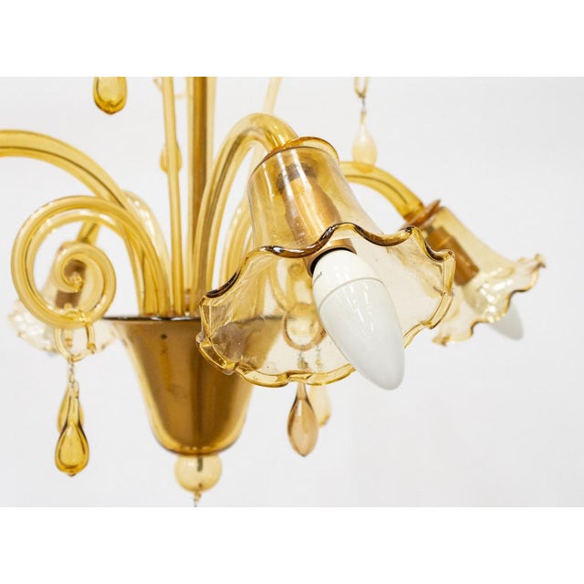 Magnificent amber murano blown glass chandelier decorative elements with a floral theme, drop pendants all in blown glass....