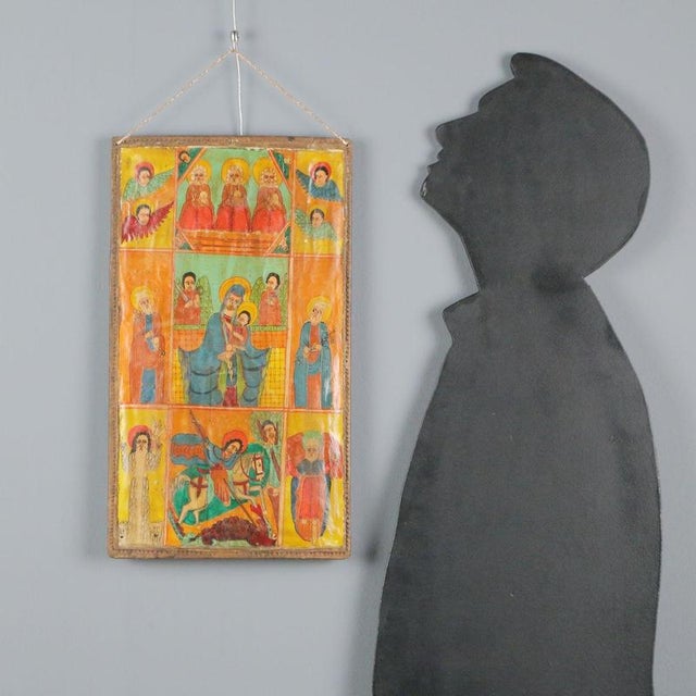 Tempera on panel. The icon, characteristic of Ethiopian and Coptic Orthodox worship, features at the center the figures of...