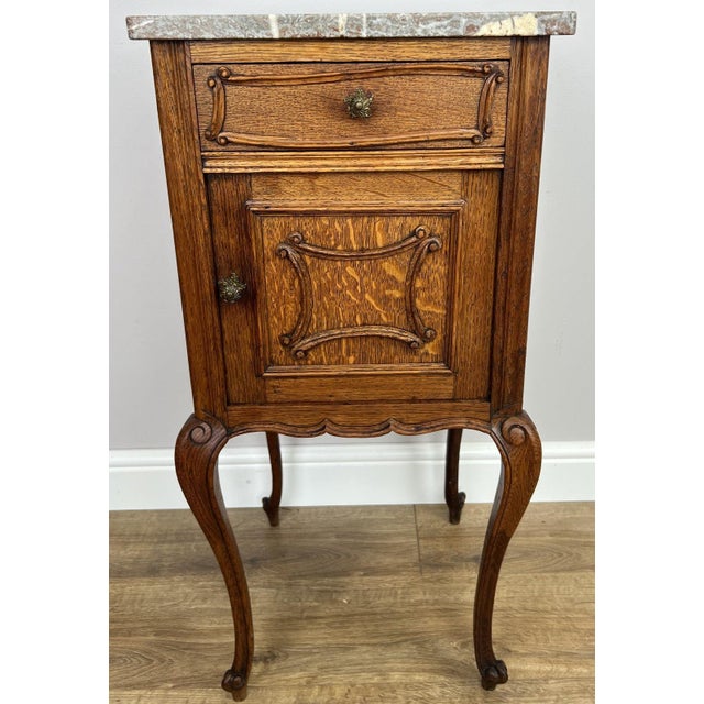 Bring timeless French elegance to your home with this Antique French Rocaille bedside table , beautifully complemented by...