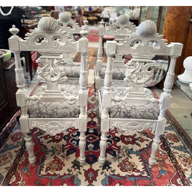 Group of 4 chairs from the 19th century, finely carved, decorated with griffins and angels. The chairs are in solid wood,...