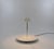 Nemea table lamp, designed by Vico Magistretti in 1979 and produced by Artemide. The model consists of a round base, with...