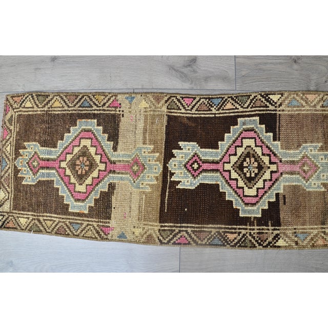 This is a vintage Turkish Oushak rug from the 1960s. The piece was hand-knotted.