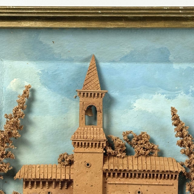his antique cork diorama presents an abandoned church set within a hand-carved architectural setting, framed by two trees...
