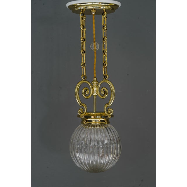 Art Deco pendant vienna around 1920s with original cut glass shade. Brass polished and stove enameled. Original cut glass...