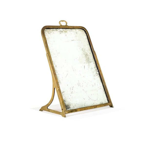 A splendid example of an early 20th century brass haberdashery show mirror. The mirror has a beautifully foxed and...