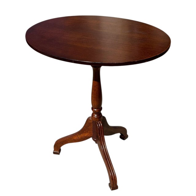 Here is a sweet, tilt-top side table made by Bombay Co. in the early 1990's. The table has a tripod base, with a pedestal...