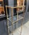 1970s glam brass post/glass etagere/bookshelf. Some minor patina to metal in a few places as shown. Otherwise excellent...