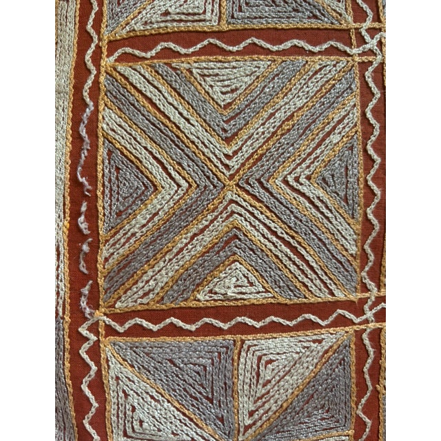 Authentic vintage tribal textile piece featuring dense, hand-crafted raised yarn embroidery intricately stitched onto a...