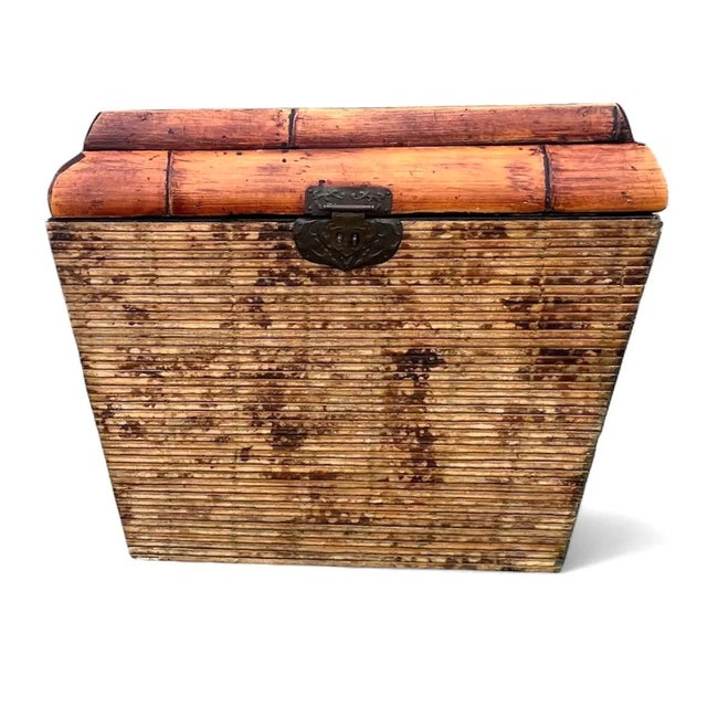 Vintage woven bamboo and rattan handles basket with braided bamboo trim with a woven inlay.