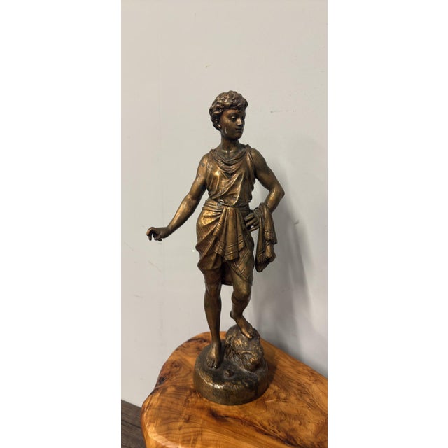 Elegant French patinated statue by Émile Bouret (1833–1906), a distinguished 19th-century sculptor known for his finely...