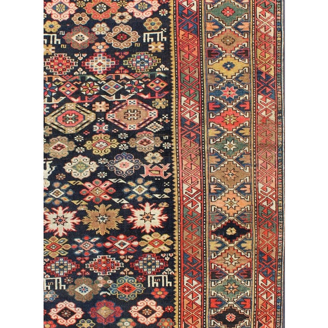 Colorful Antique Kuba Carpet with Intricate Geometric Design This Kuba rug from the southern Caucasus features many...