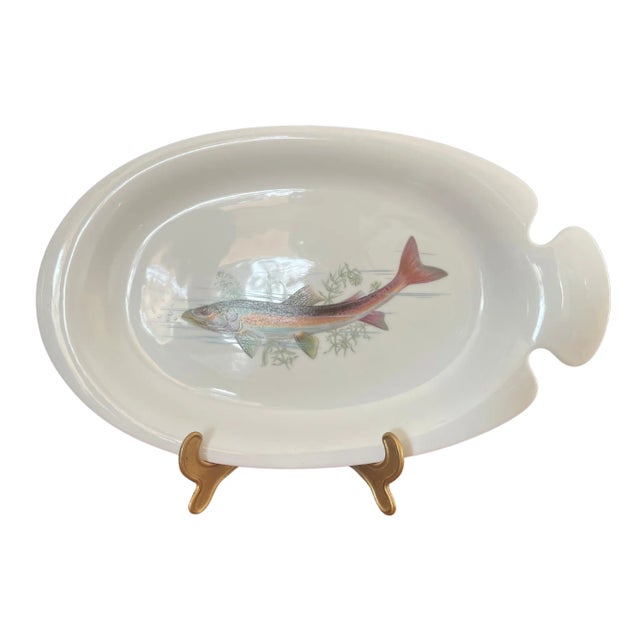 A stunning set of Limoges porcelain fish-themed serving dishes, consisting of one large platter and six plates. Each piece...