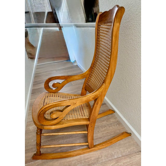 Vintage Victorian maple wood bentwood cane rocking chair with hand crafted stitched woven borders and solid wood...