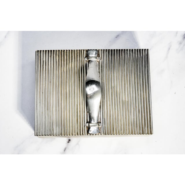 A striking example of early twentieth-century gentleman’s desk and smoking-room accessories, this circa 1910 silverplate...