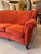 An exceptional large 4 seater semi circular wingback sofa newly upholstered in lush coral orange textured velvet by our...