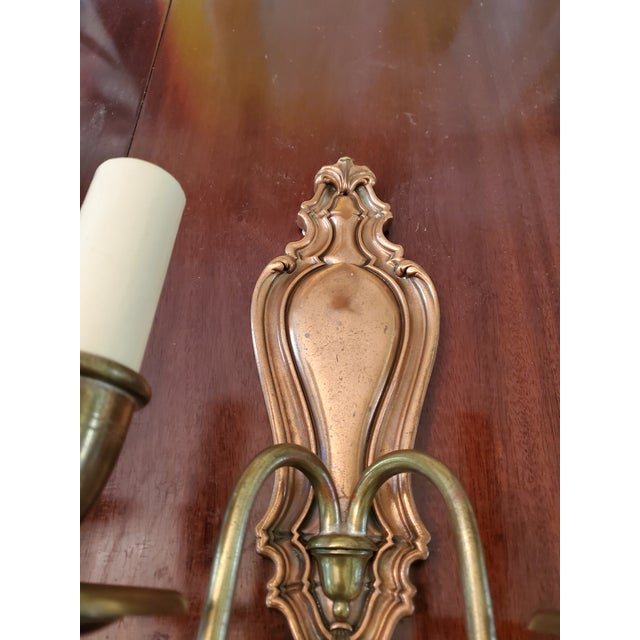 An antique original pair of e f caldwell attributed sconces. Having stylized Regency design in copper and brass ( all...