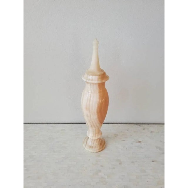 A magnificent Neoclassical styled alabaster lidded urn form vessel. Likely Italian in origin, the exceptionally executed...