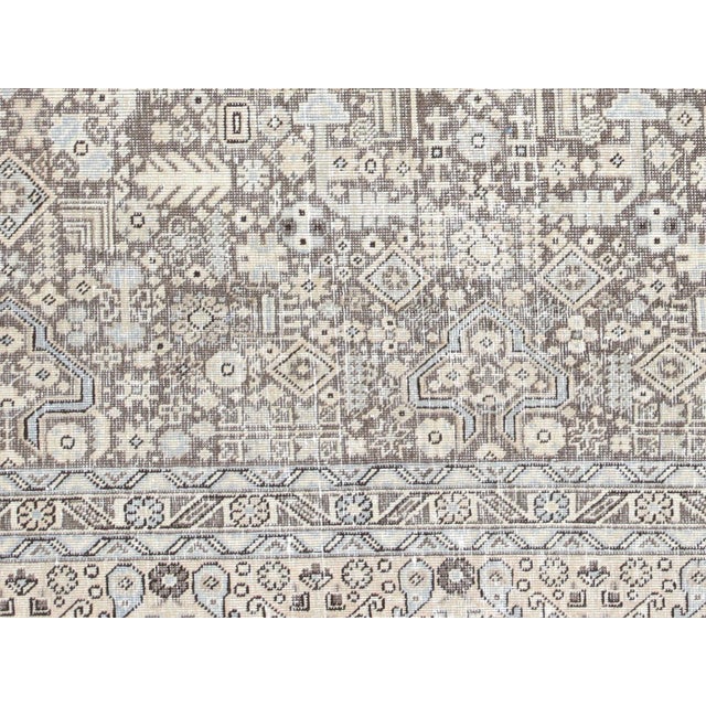 This lavish hand-knotted Persian Tabriz rug adds the perfect touch of elegance to any space. Its intricate design features...