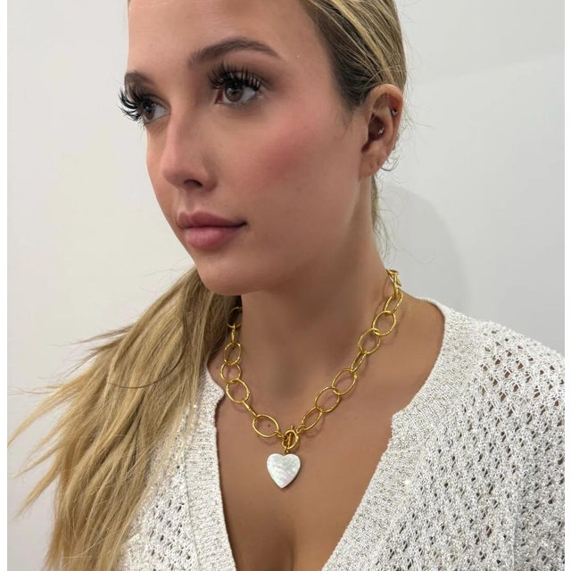 Our cloud chain paired with a Mother of Pearl heart. Toggle closure. 18”
