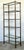 This vintage burnished brass etagere is a masterclass in Hollywood Regency sophistication. The slender metal frame...