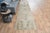 Vintage Hand-Knotted runner rug is a semi-antique vintage area rug. The '70s Eastern region of Anatolia's unique rug is...