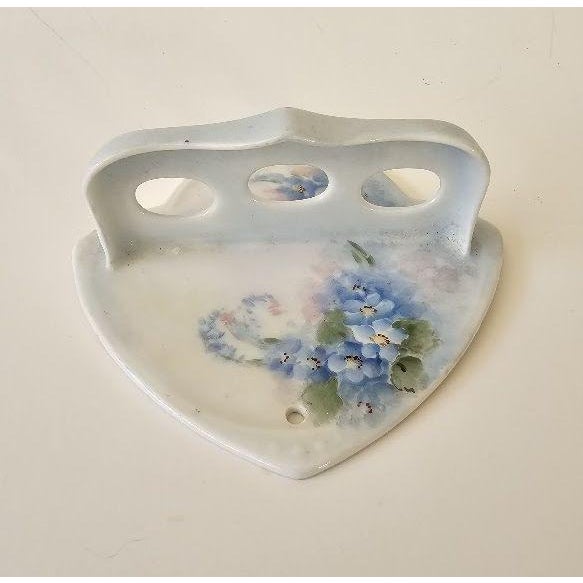 Gorgeous hand painted blue forget me nots floral porcelain toothbrush holder by RS Prussia. Circa 1912. Beautiful matte...