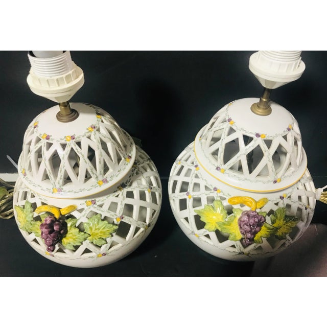 Gorgeous and rare pair of 2 table lamps from the Faiencerie d’art de malicorne in France. They are Reticulated in white...