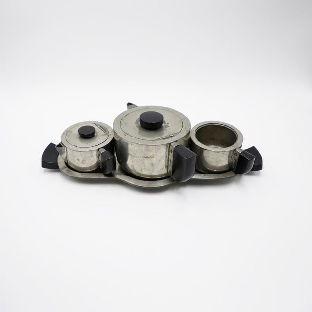 Circa 1960, we offer this Art Deco Coffee Set made in bakelite and pewter, fantastic patina.