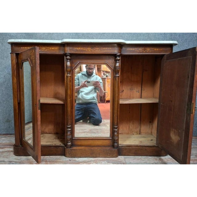 An elegant Napoleon III period sideboard or buffet in precious wood veneer and marble, dating from the late 19th century....