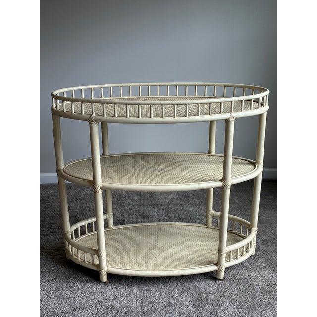 Elegant vintage McGuire San Francisco three-tier oval console shelf or bar cart featuring the brand’s iconic faux bamboo...
