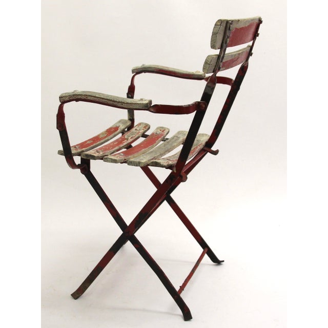 French-style garden chair with armrests, child-sized. Works.