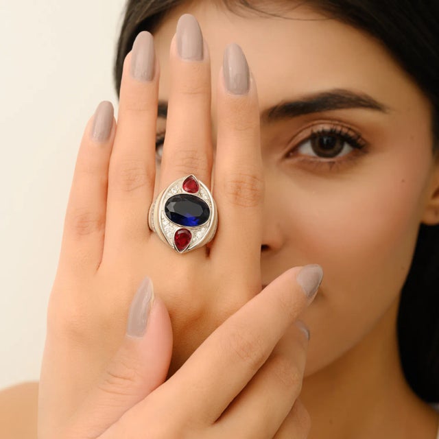 Add a pop of color and timeless elegance to your jewelry collection with this sterling silver cocktail ring. Featuring...