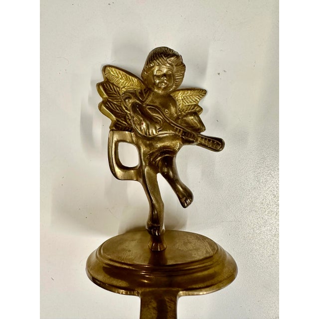 French antique solid brass cherub figurine stocking holder.