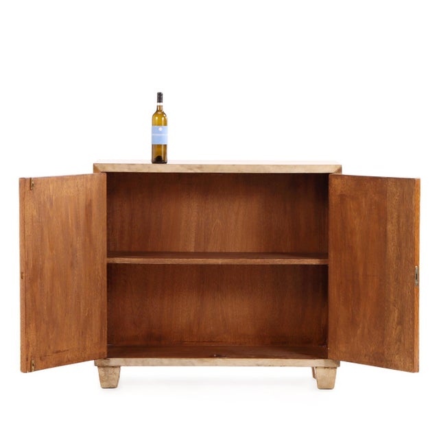 A contemporary South American cabinet in the manner of Jean-Michel Frank, clad in parchment and mica with a refined,...