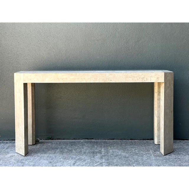 Exemplifying the sleek, clean-lined aesthetic of late 20th-century design, this vintage tessellated stone console table...