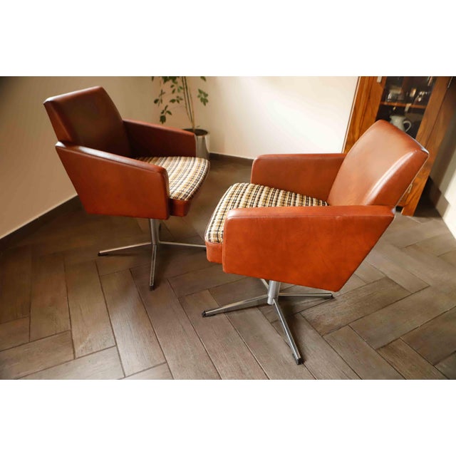 This distinctive pair of swivel armchairs was manufactured in East Germany during the 1970s. Their design reflects the...