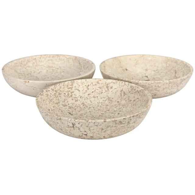 Subtly grained white marble reveals its fascinating variances in these simple but modern bowls. The more the merrier!