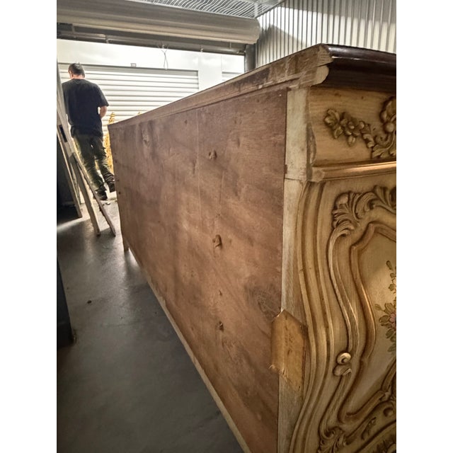 Grand and highly decorative Rococo Revival dresser or sideboard featuring an elegant serpentine silhouette, richly carved...