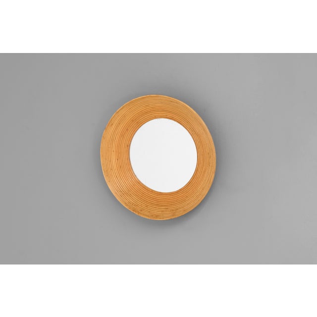 Small cane bowl shaped mirror. Original glass. France circa 1960. Great overall condition.