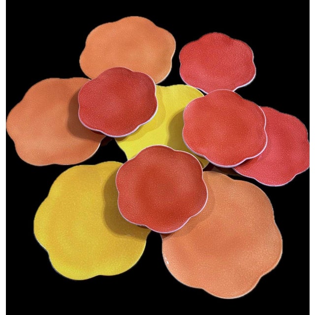 Beautiful Italian flower shaped dinnerware, with vibrant colors of yellow, orange and coral. Featuring a round scalloped “...