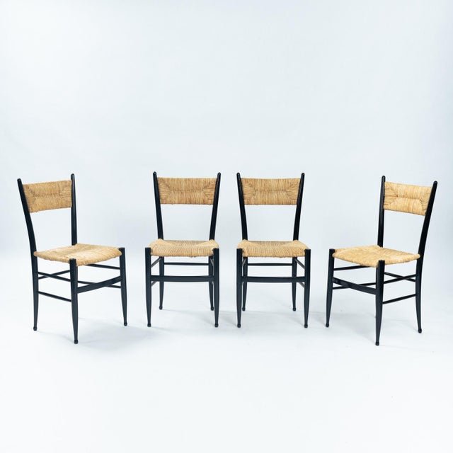 Very elegant and rare set of 4 Chiavari chairs attributed to Guido Chiappe with straw seats and backrests. The chairs are...