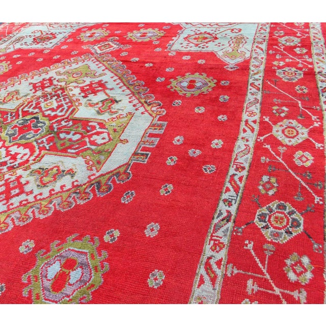 Large Antique Oushak Rug in Red, Acid Green and Ice Blue by Keivan Woven Arts Antique Oushak rug with beautiful red,...