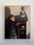 In "Noumena," a figure stands beside a wooden shelf, their expression illuminated by soft light that accentuates the...