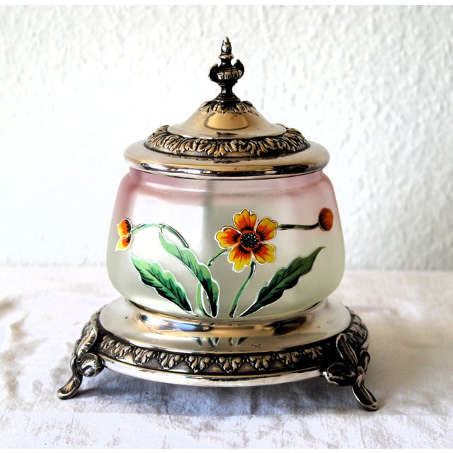Glass with foral enamel painting, manufactured between 1885 - 1903, metall is silver-plated brass decorated with foral...