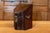 An English Georges III period walnut box from the early 18th century with slanted lid and brass hardware. This exquisite...