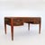 A fine Art Deco desk with five drawers. Beautiful hardwood veneers. Hardware of patinated bronze including round sabots...
