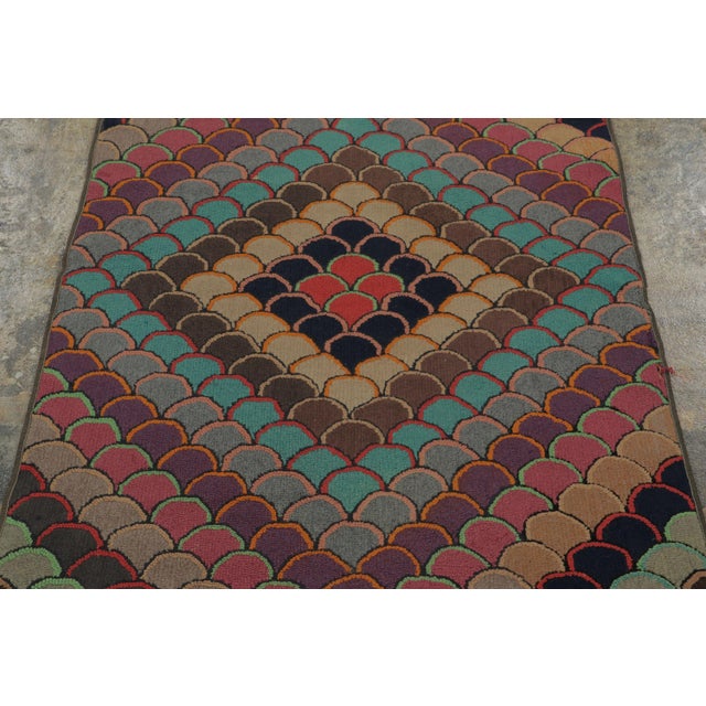 This antique 3x5 American hooked rug, circa 1920–1929, features a striking geometric visual juxtaposition of layered...