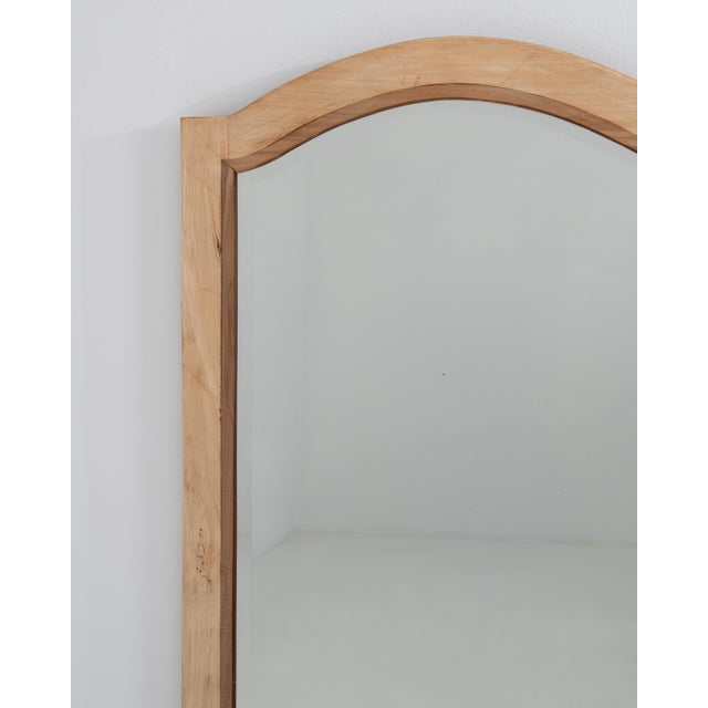 A larger-scale wooden mirror offering strong vertical presence and the ability to visually expand space. The...