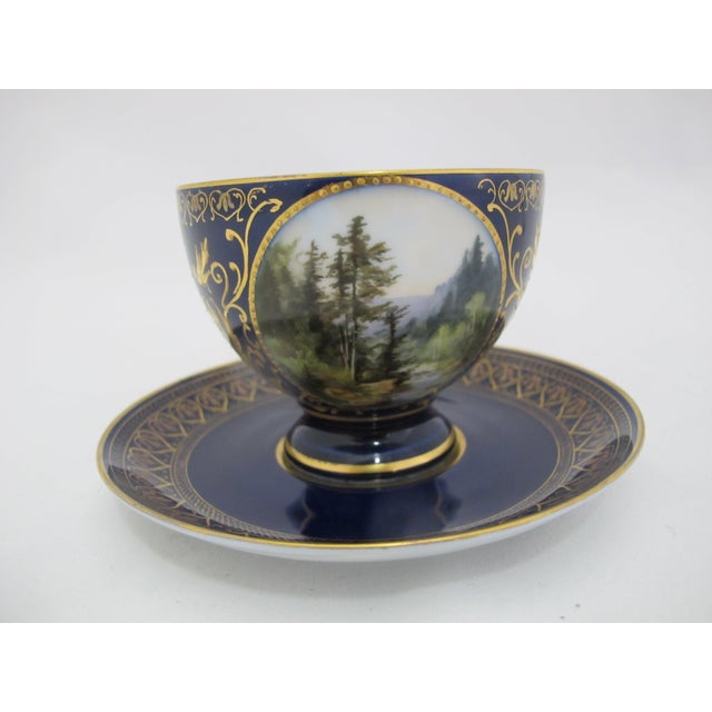 19th century, Carl Knoll, Karlsbad Hermann Voigt, Bohemia porcelain cup and saucer. Cobalt blue with ornate gilt accents...
